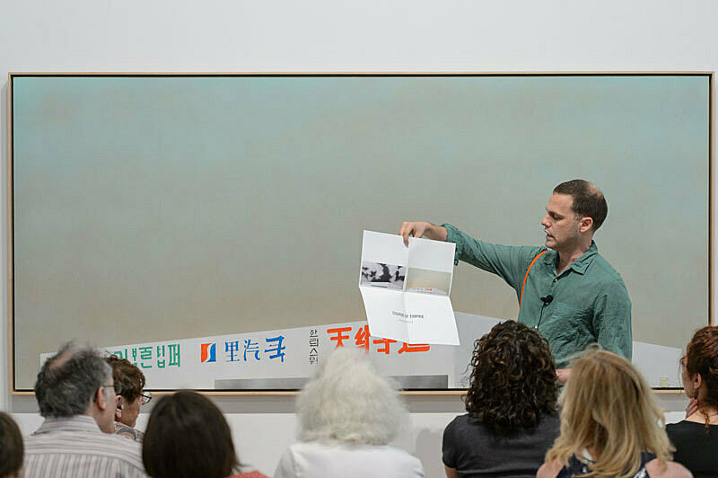 People gathered for a talk in the gallery.