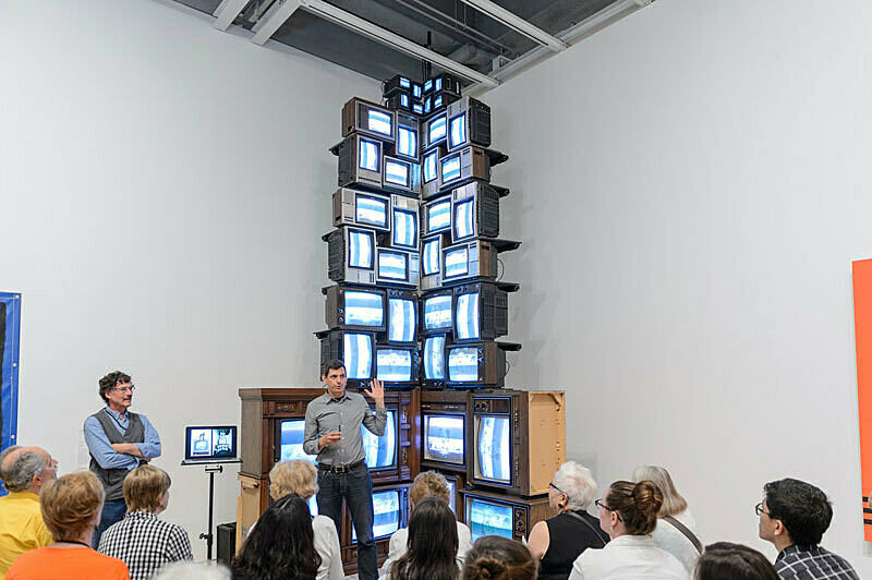 People gathered for a talk in the gallery.