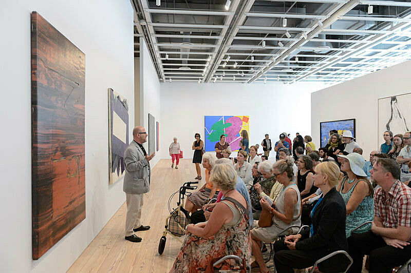 People gathered for a talk in the gallery.