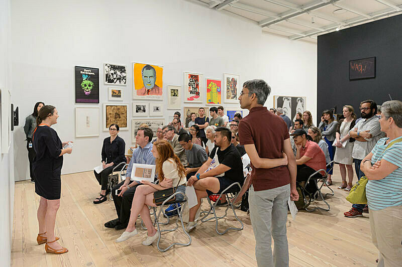 People gathered for a talk in the gallery.
