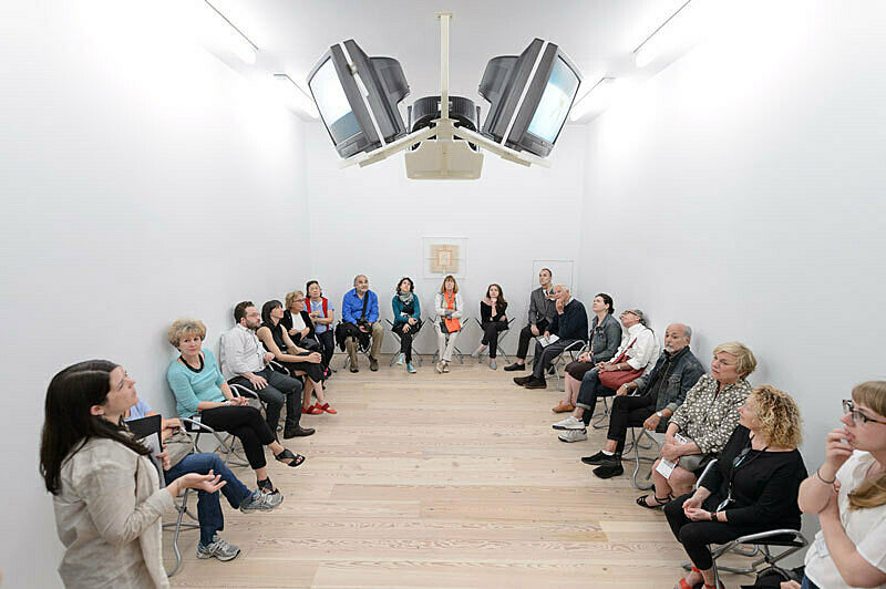 People gathered for a talk in the gallery.