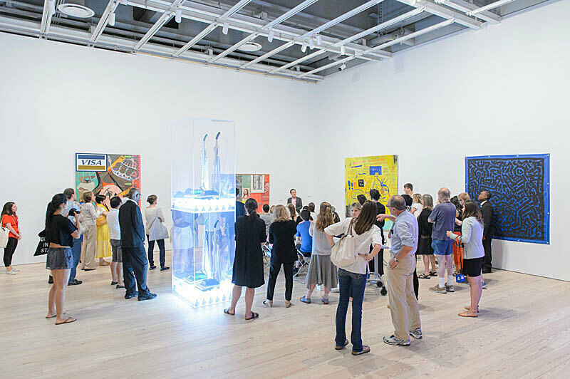 People gathered for a talk in the gallery.