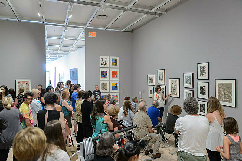 People gathered for a talk in the gallery.