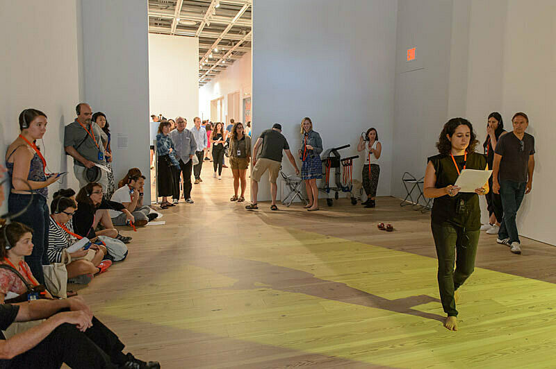 People gathered for a talk in the gallery.