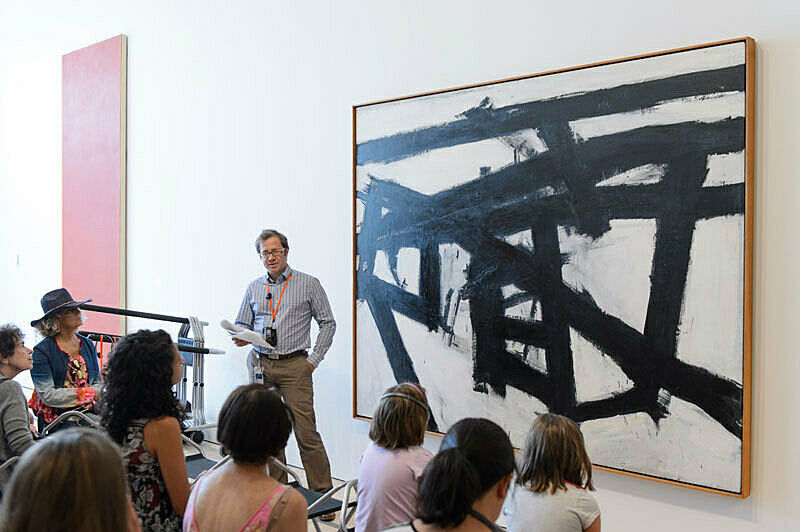 People gathered for a talk in the gallery.