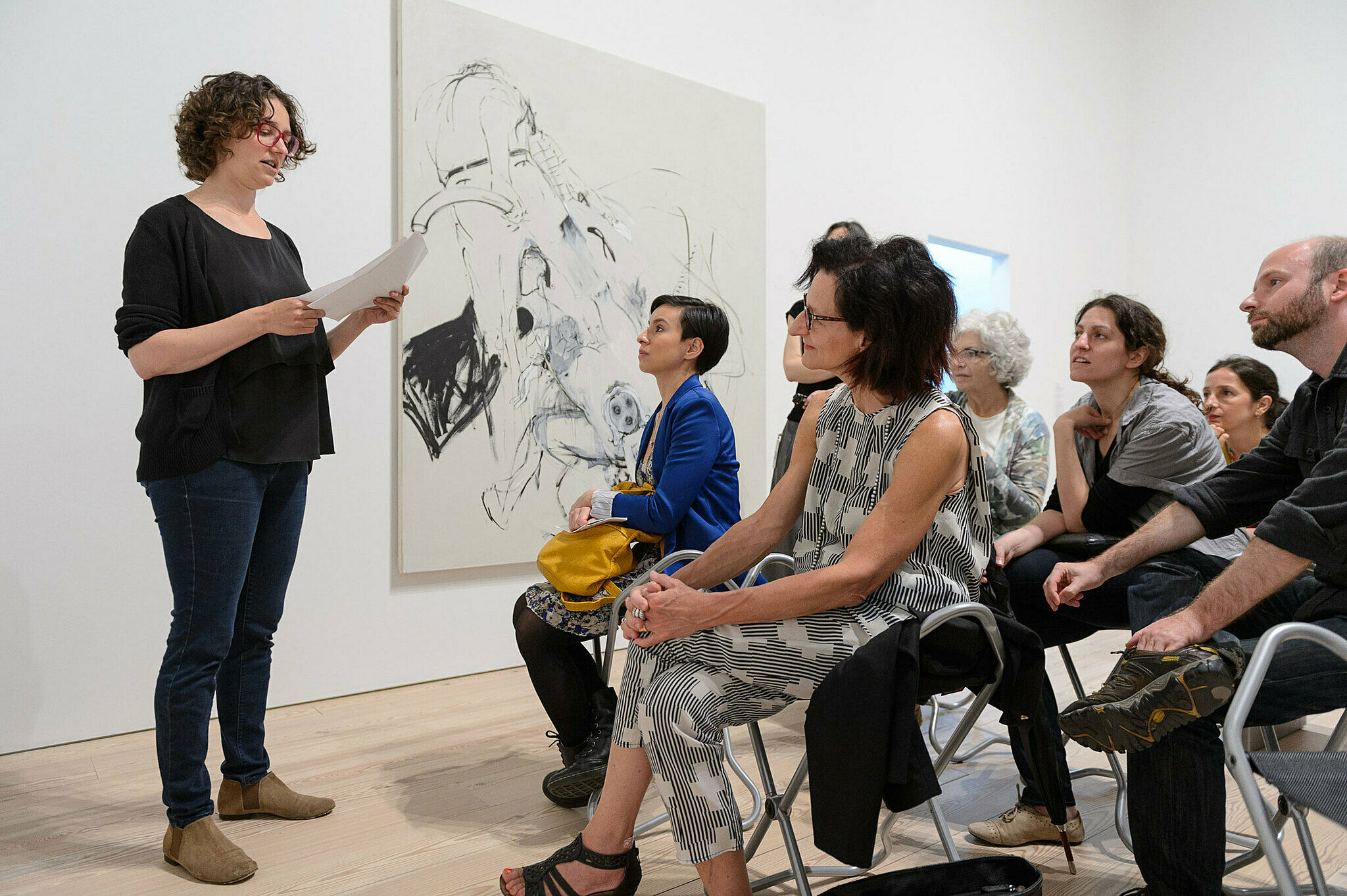 People gathered for a talk in the gallery.