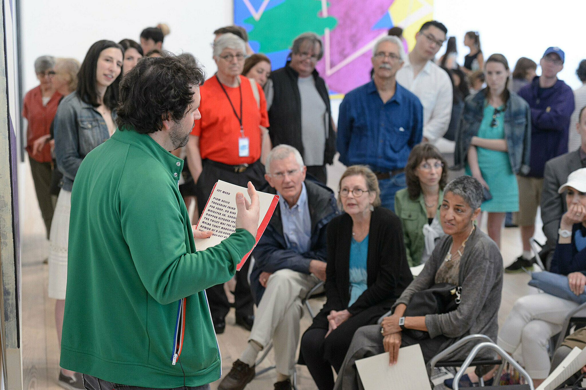 People gathered for a talk in the gallery.