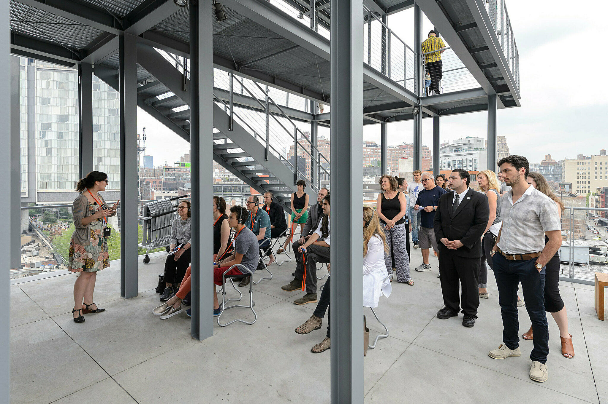 People gathered for a talk on the terrace.