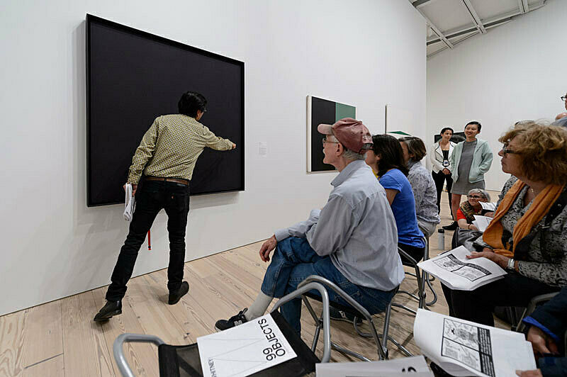 People gathered for a talk in the gallery.