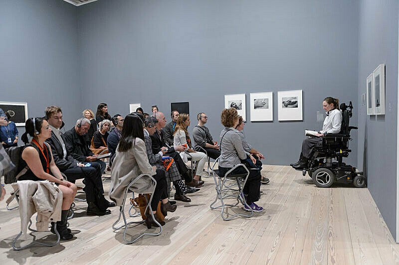 People gathered for a talk in the gallery.