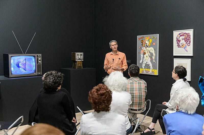 People gathered for a talk in the gallery.