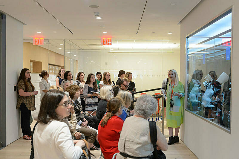People gathered for a talk in the gallery.