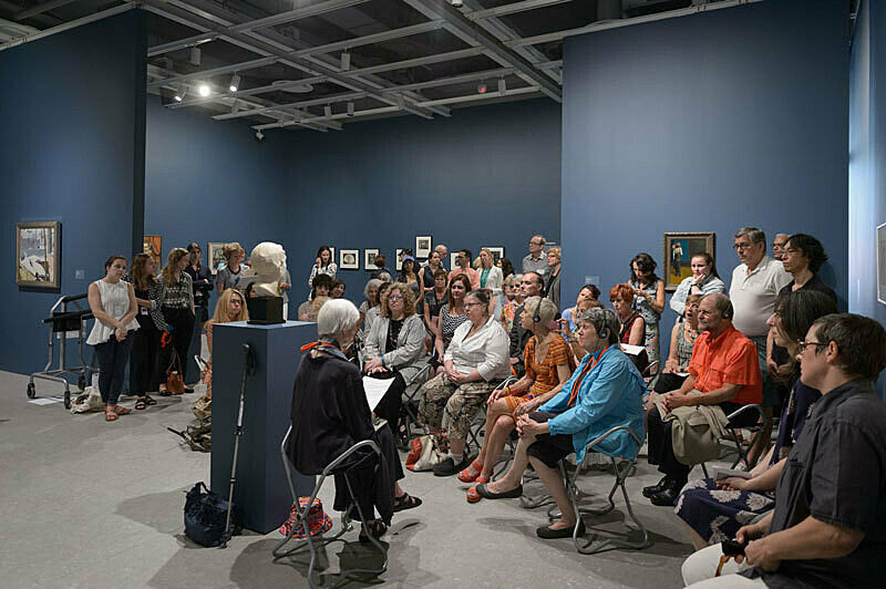 People gathered for a talk in the gallery.