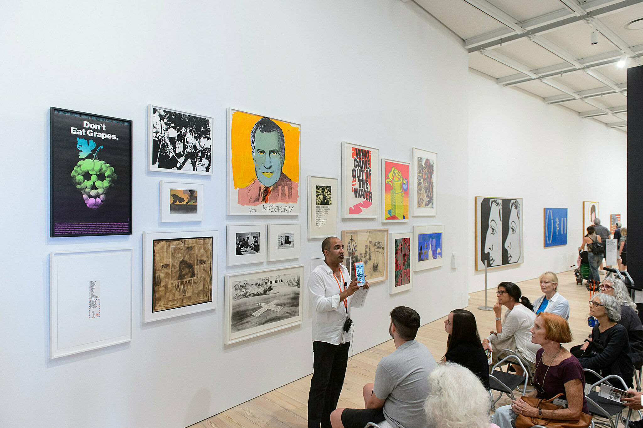 People gathered for a talk in the gallery.