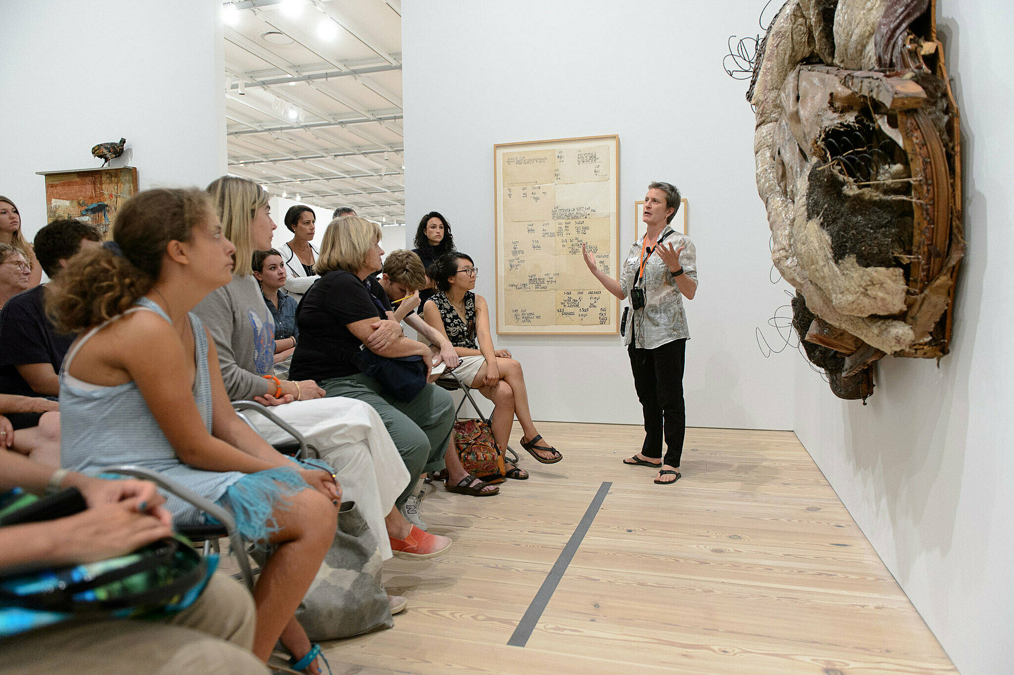 People gathered for a talk in the gallery.