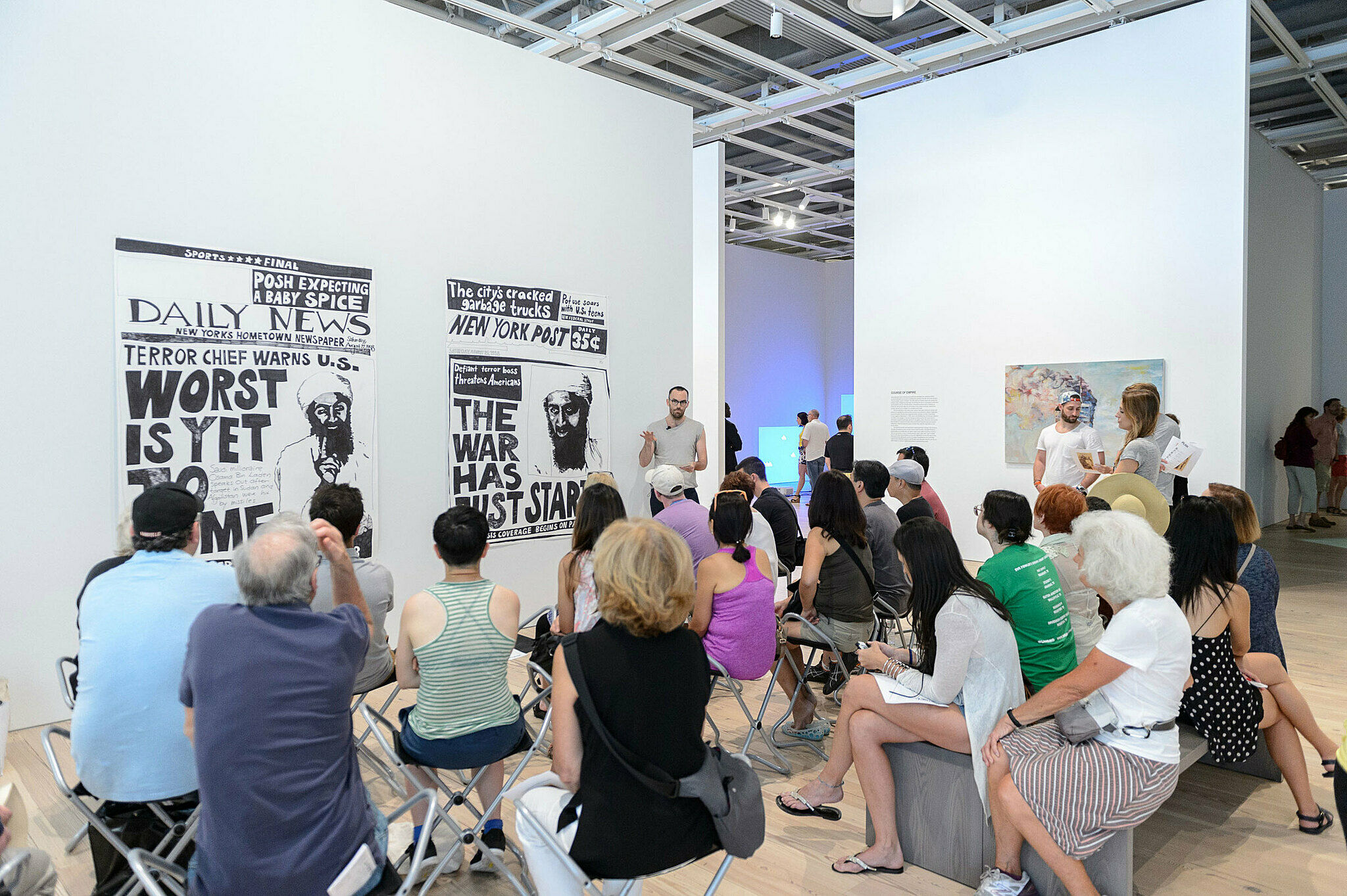People gathered for a talk in the gallery.