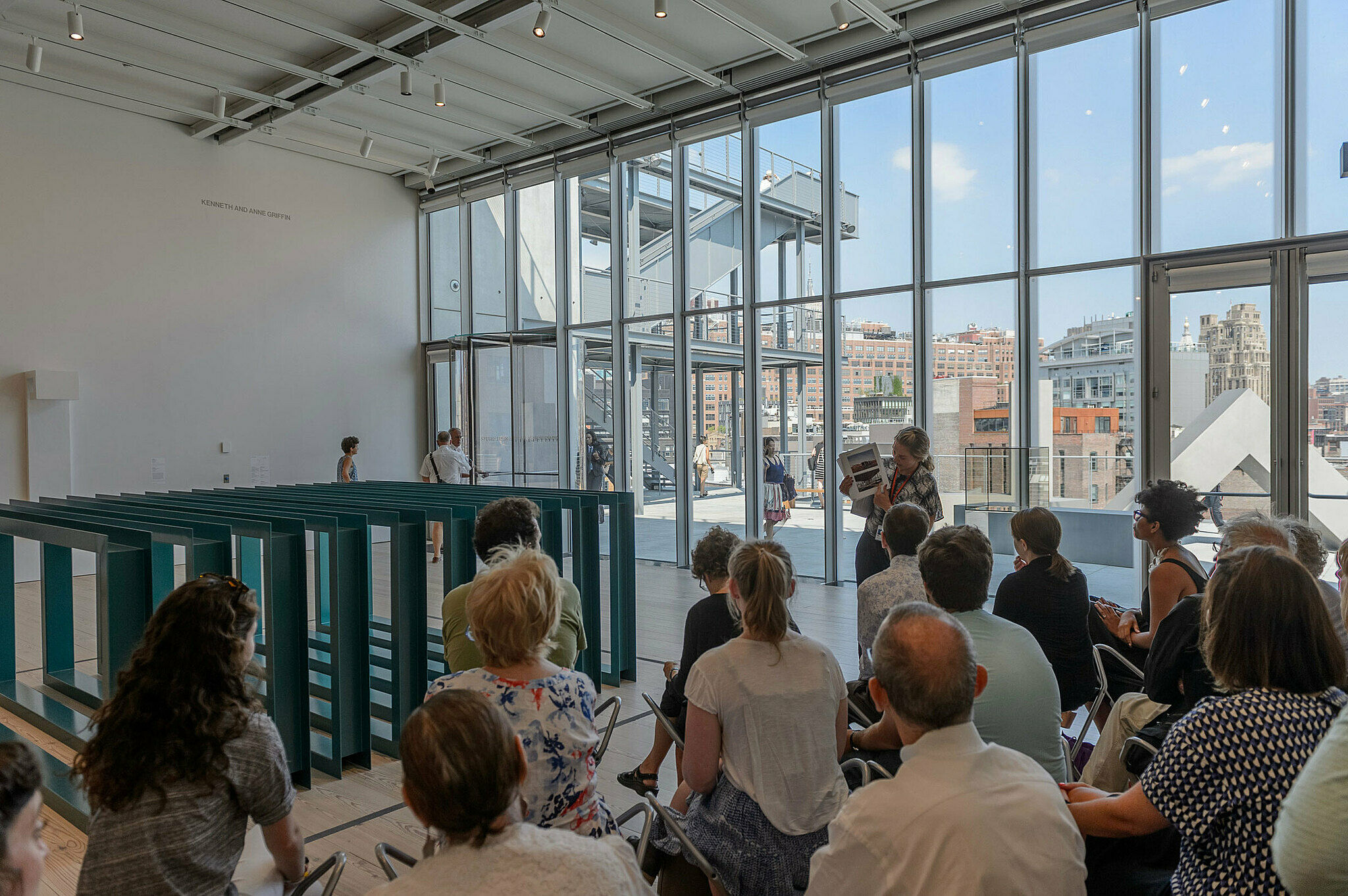 People gathered for a talk in the gallery.