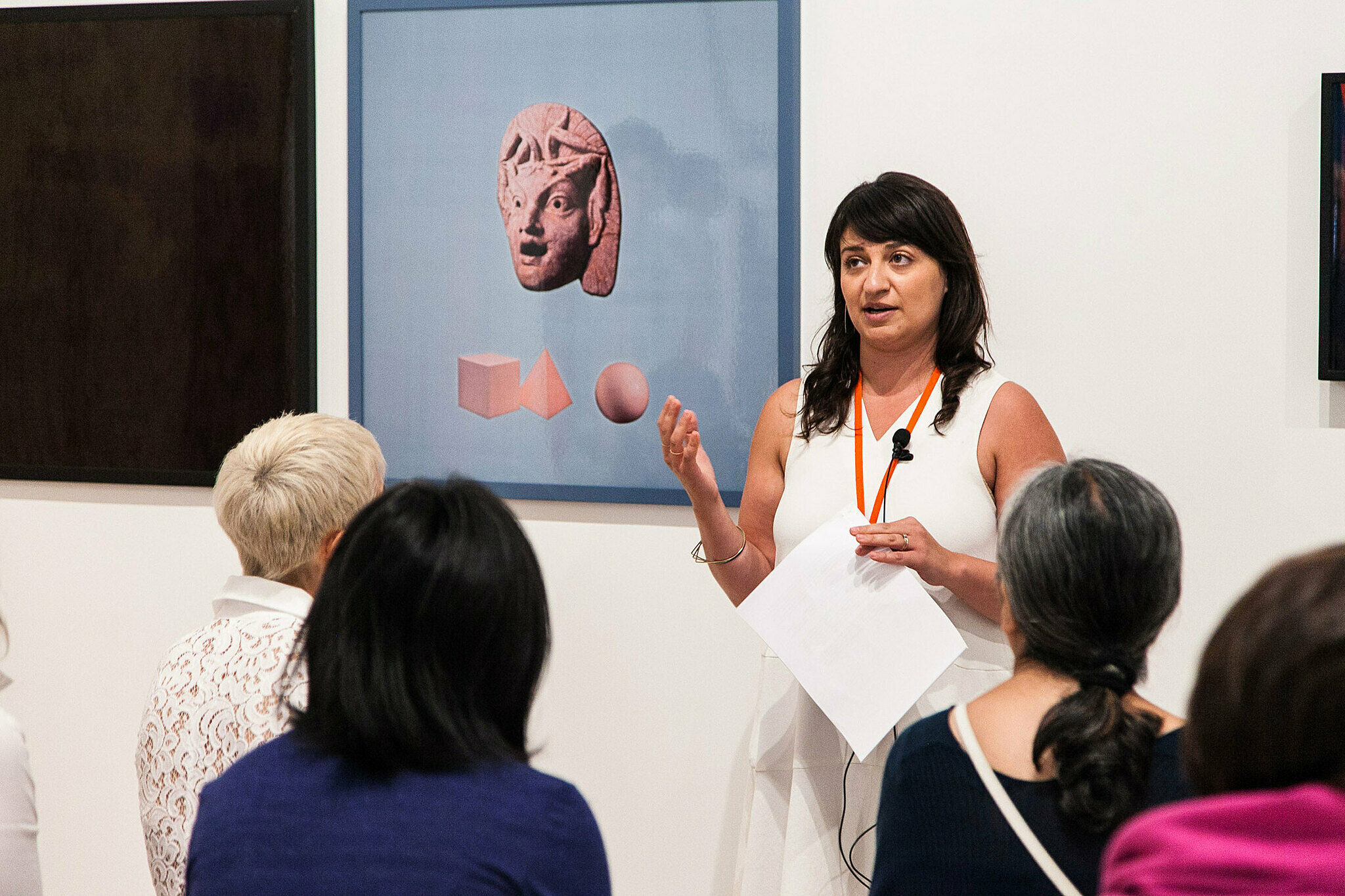 People gathered for a talk in the gallery.