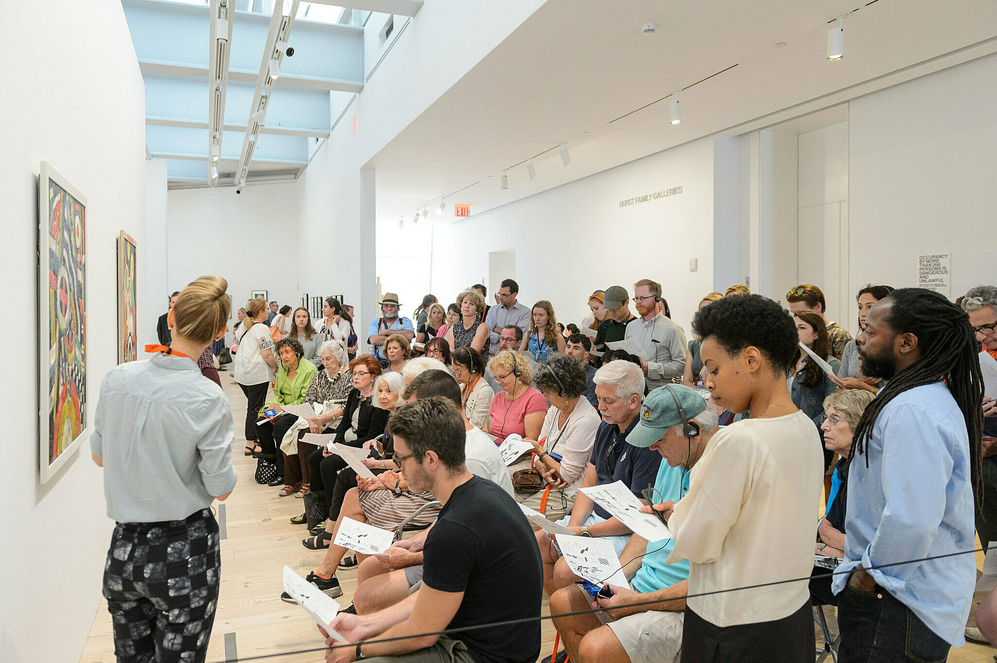 People gathered for a talk in the gallery.