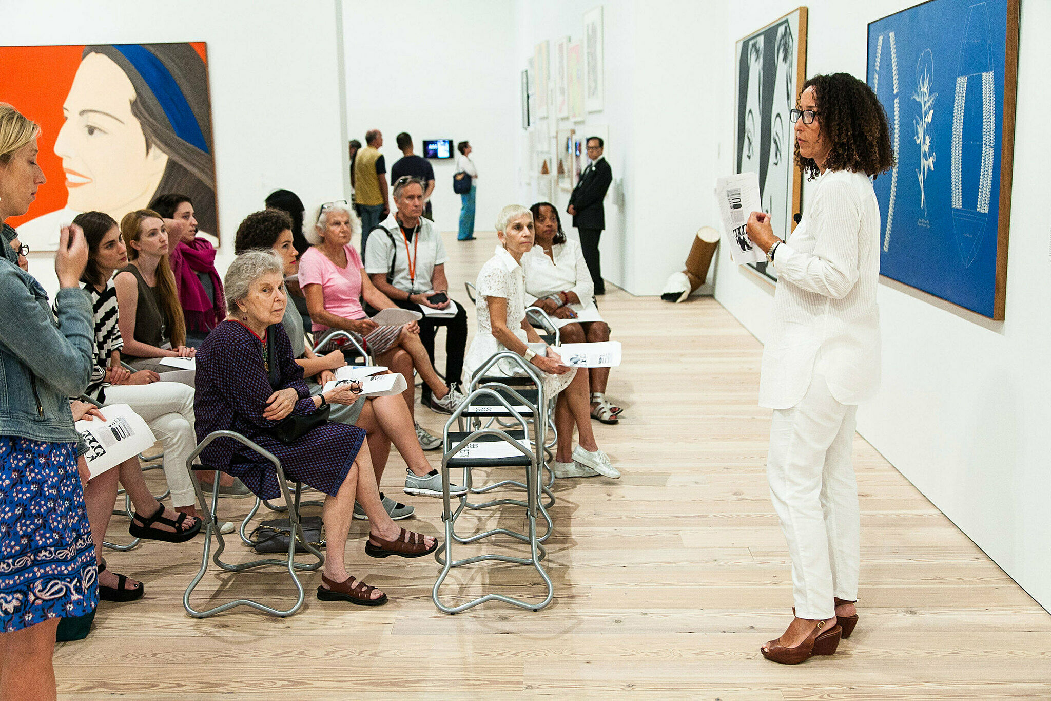 People gathered for a talk in the gallery.