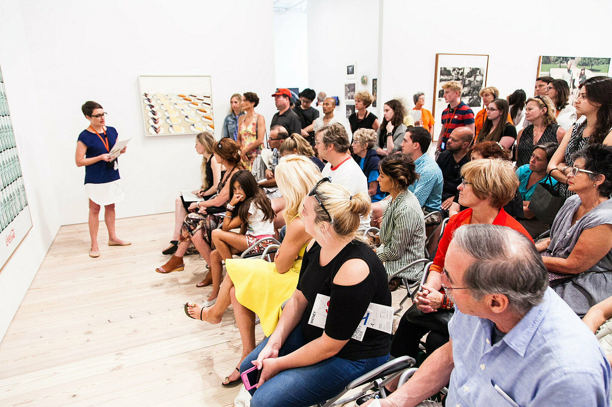 People gathered for a talk in the gallery.