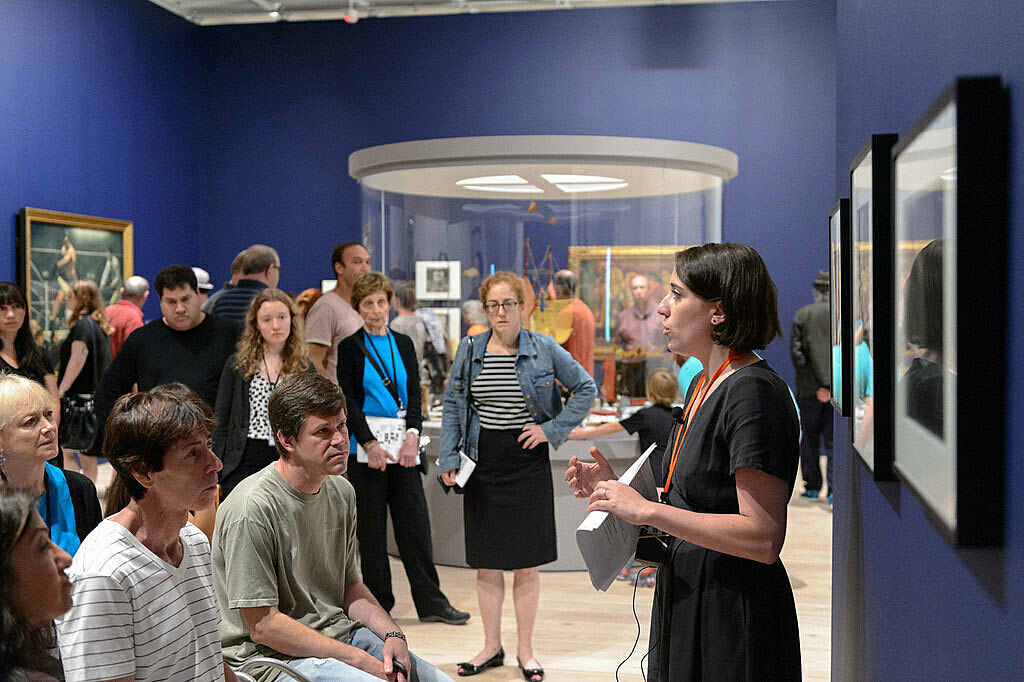 People gathered for a talk in the gallery.