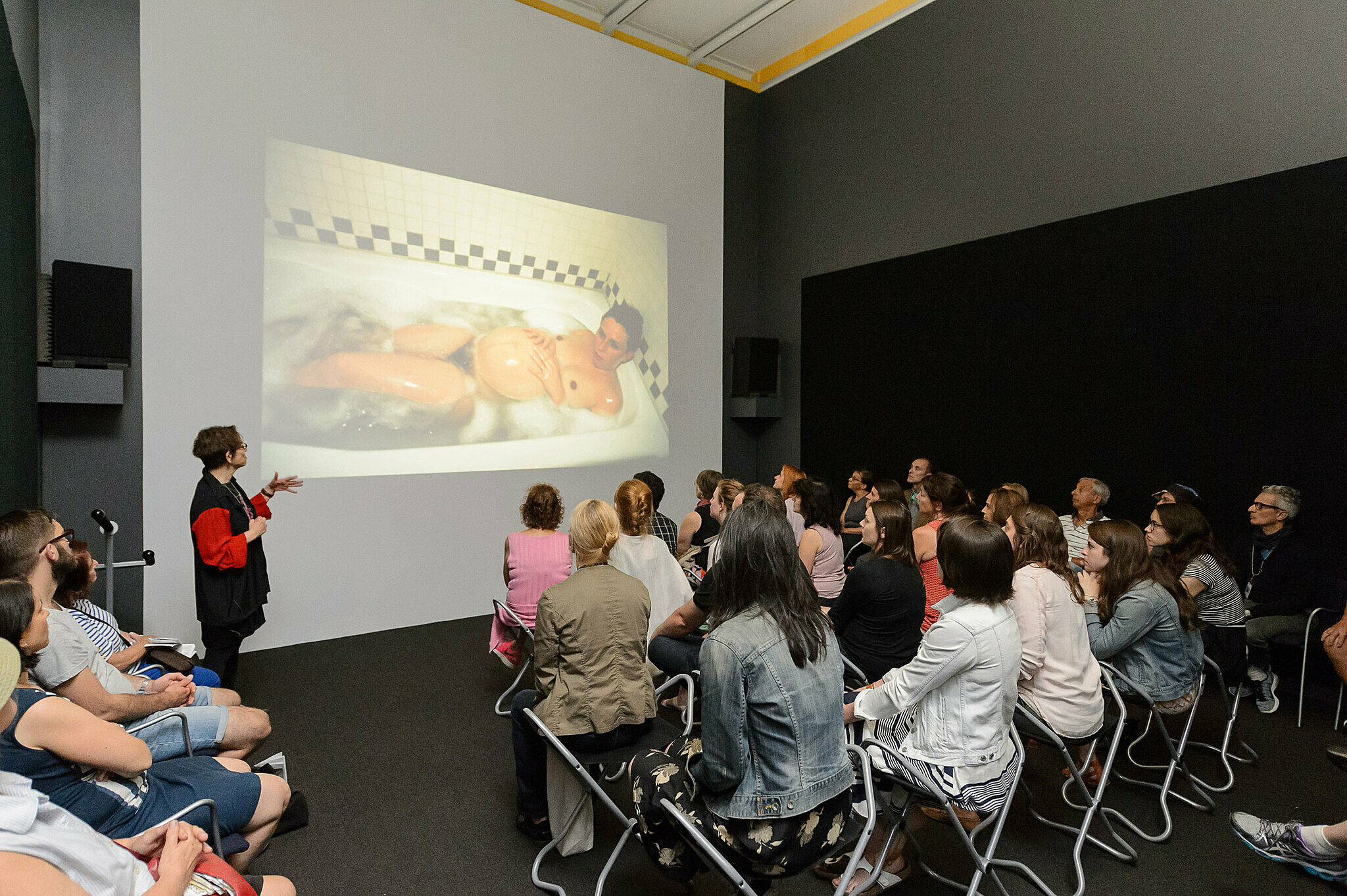 People gathered for a talk in the gallery.