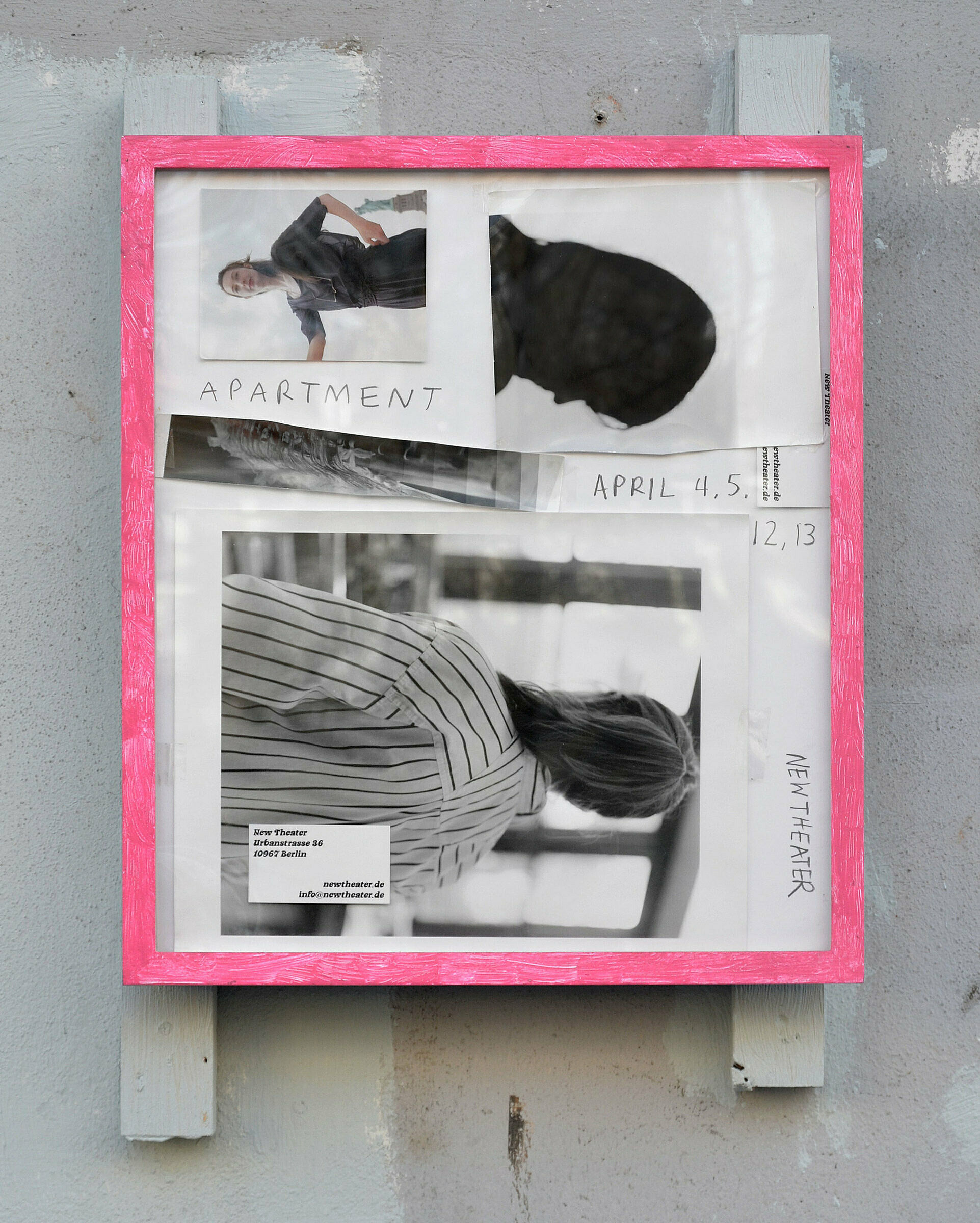 A pink-framed poster on a wall featuring black and white photos of three people and text.