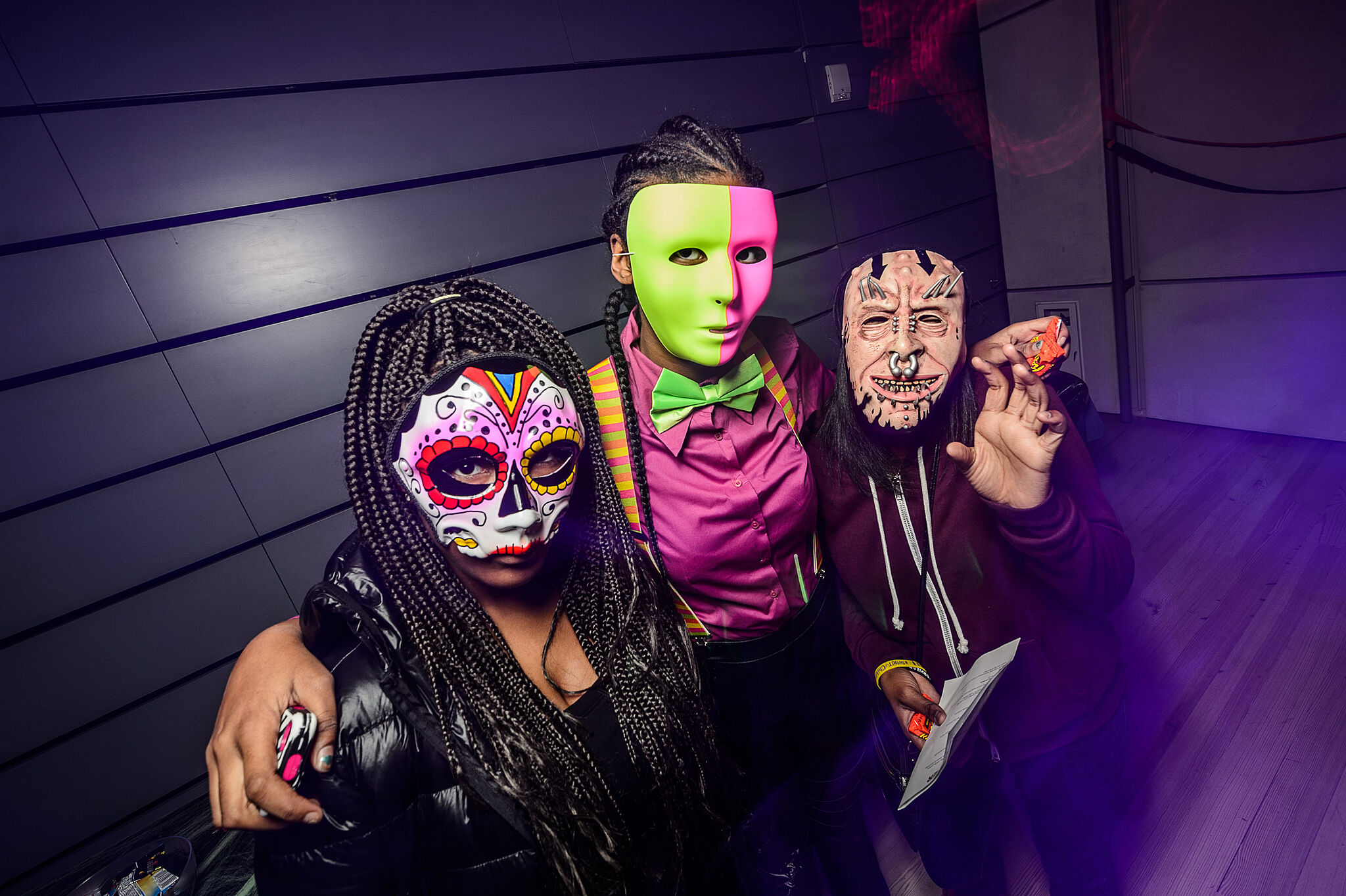 Three teens pose in costume.