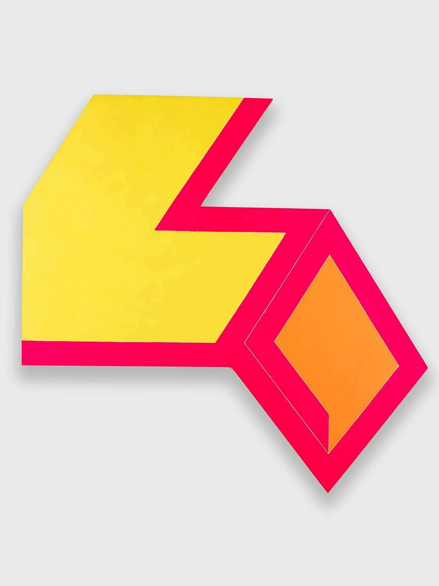 An angular-shaped canvas with yellow and red paint.