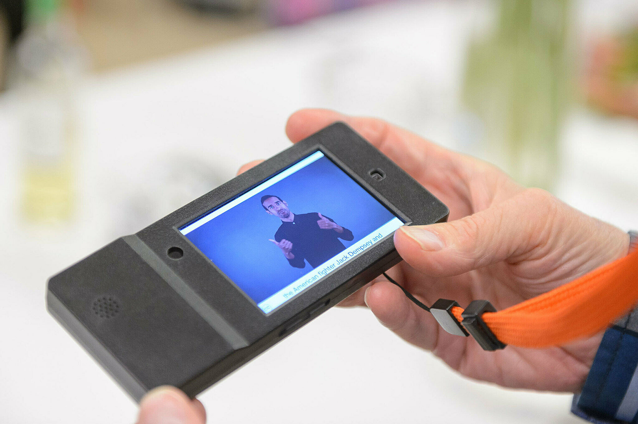 An ASL Multimedia Guide is used by a visitor in the galleries.