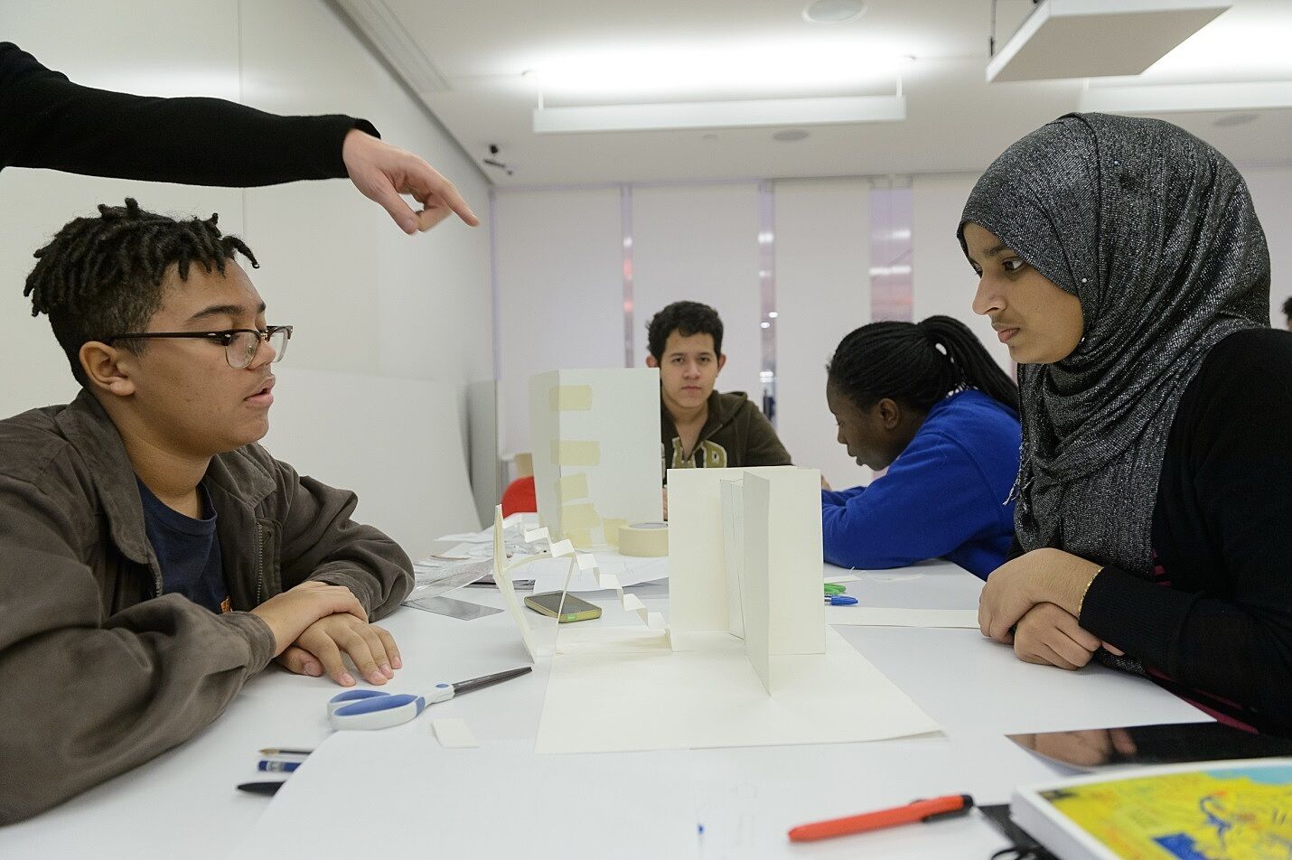 Teens work on a project with Ruiz in the Hearst Artspace