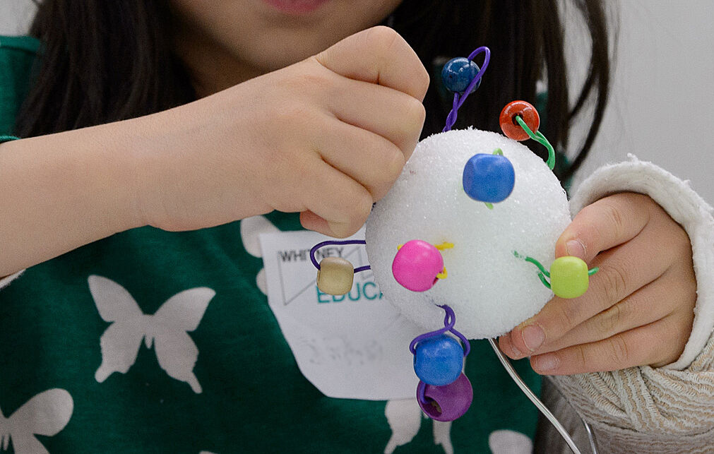 A child makes a sculpture in the galleries.