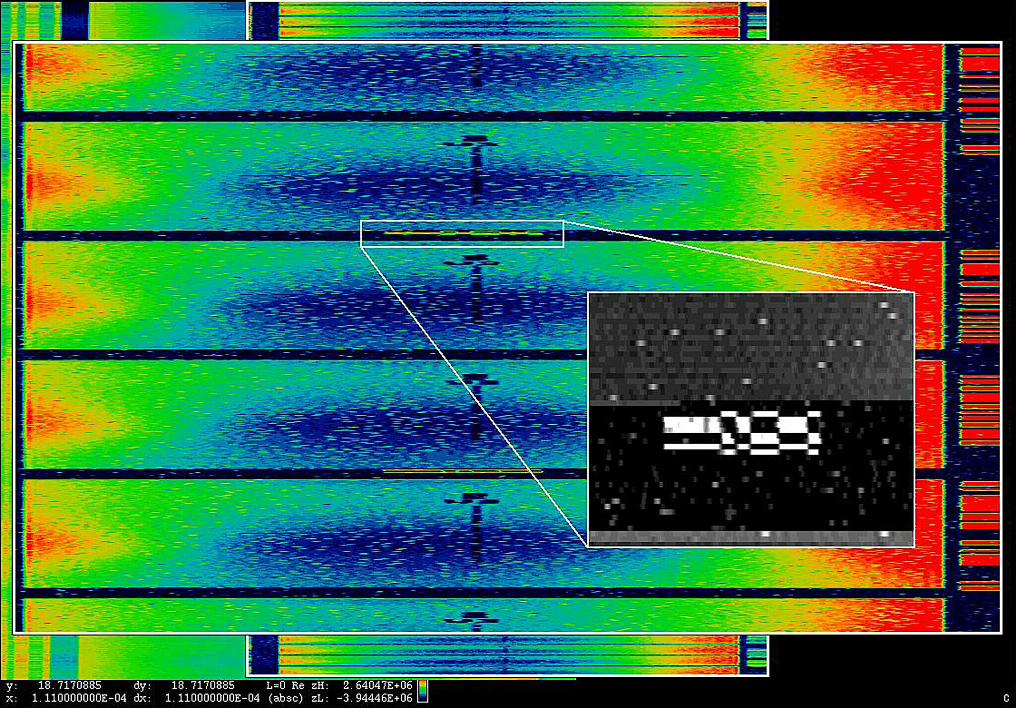 A surveillance image. Brightly colored streaks, with another small black and white image inset.