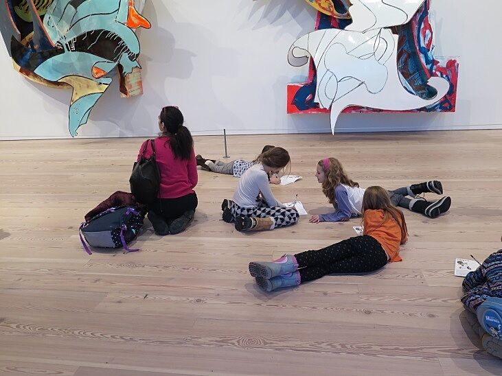 Children working on a project in the Frank Stella gallery
