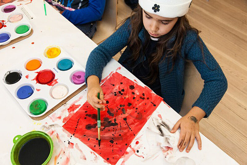 A child works on an art project