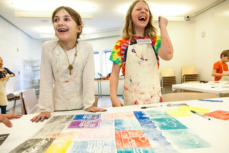Two kids laughing during art camp