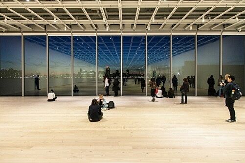 Students sit in the open gallery space