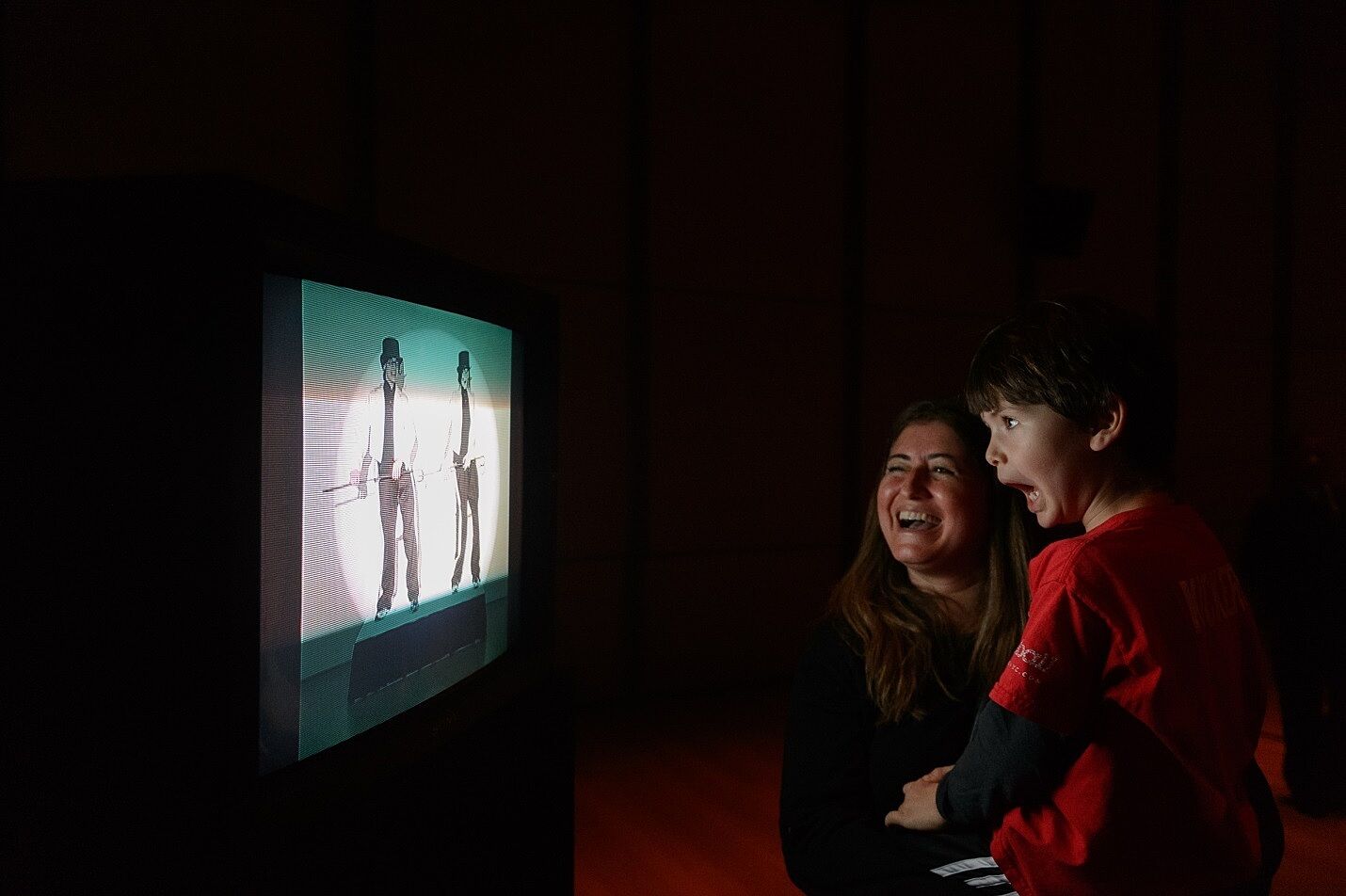 A family explores an art installation by Jamie Isenstein