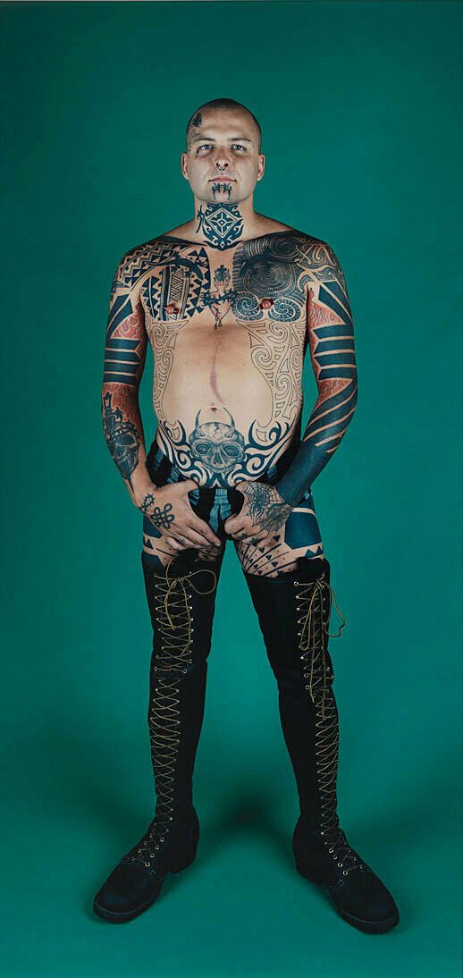A work by Catherine Opie. Performance artist Ron Athey stands posing for a portrait