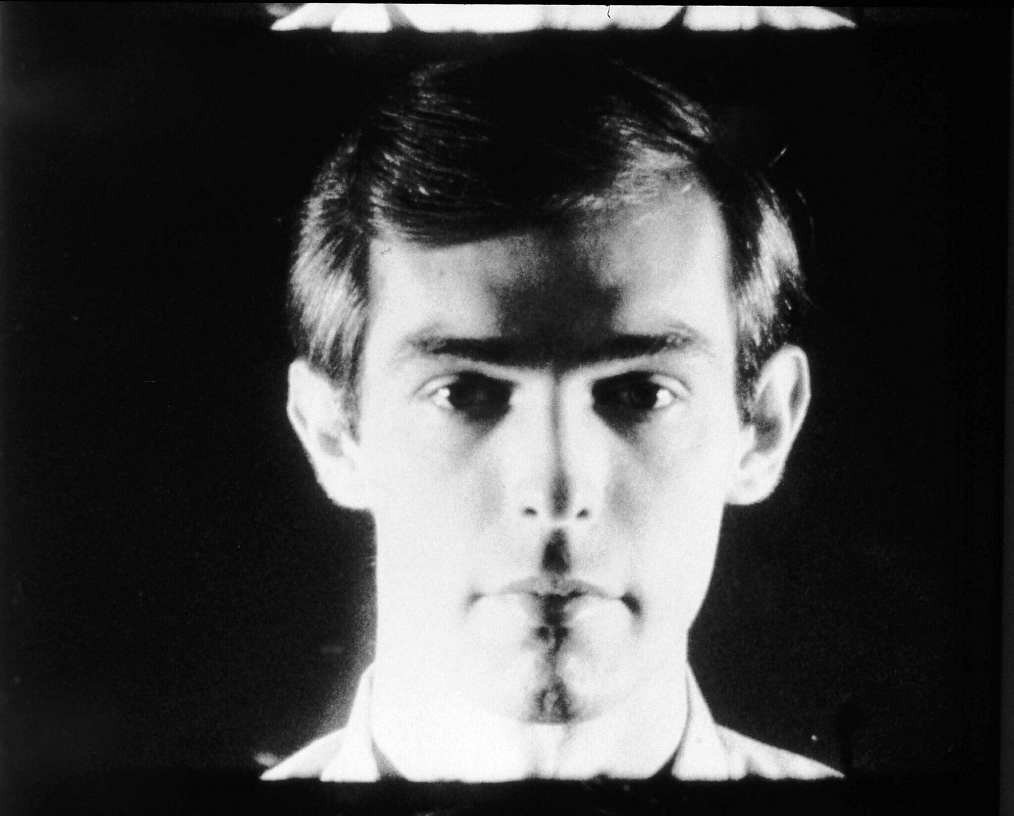 A still of a film work by Andy Warhol. Peter Hujar is depicted in black and white