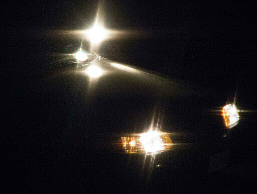 Jewelry glint with bright light on a black background.