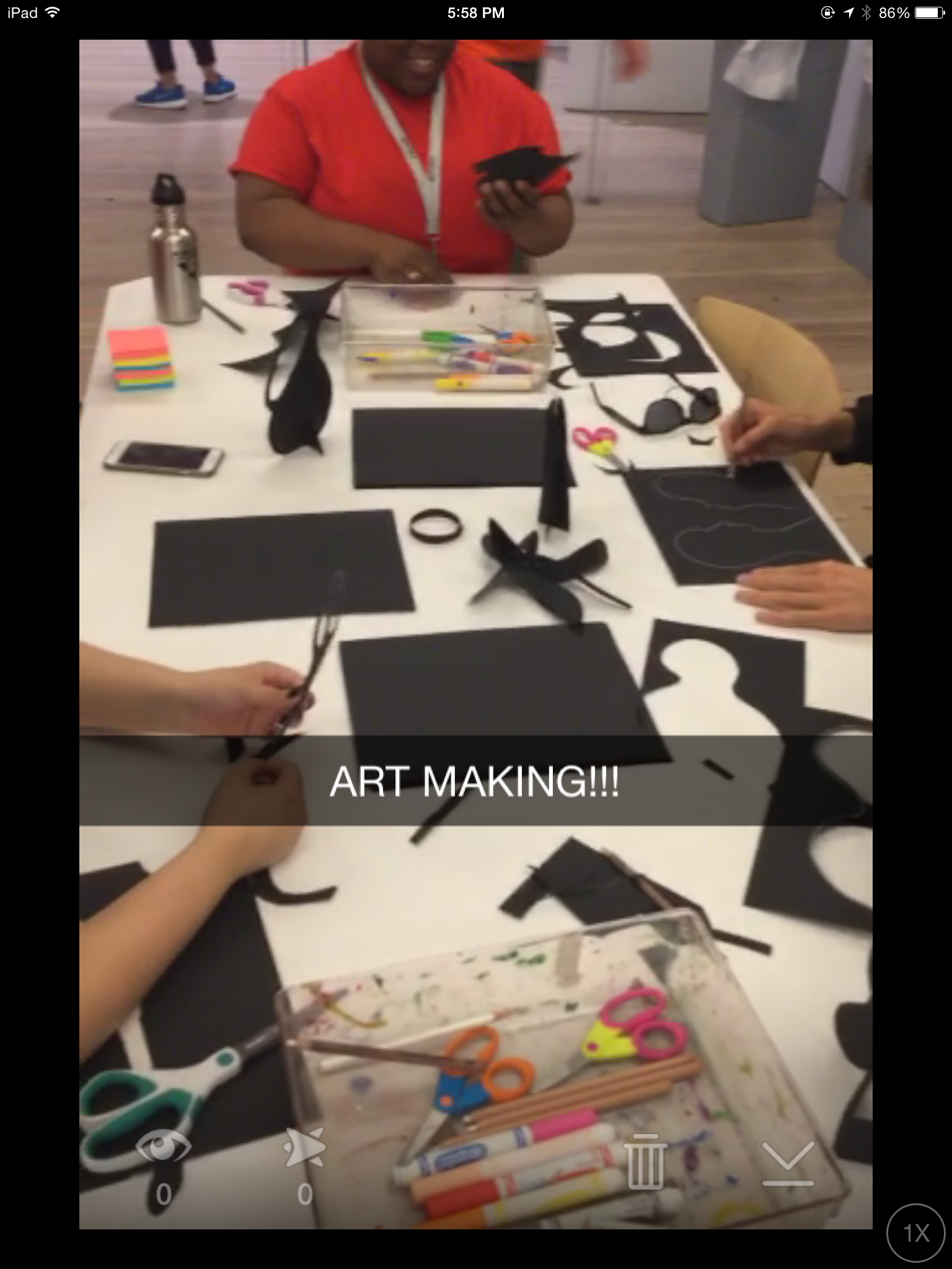 Students make art around a table