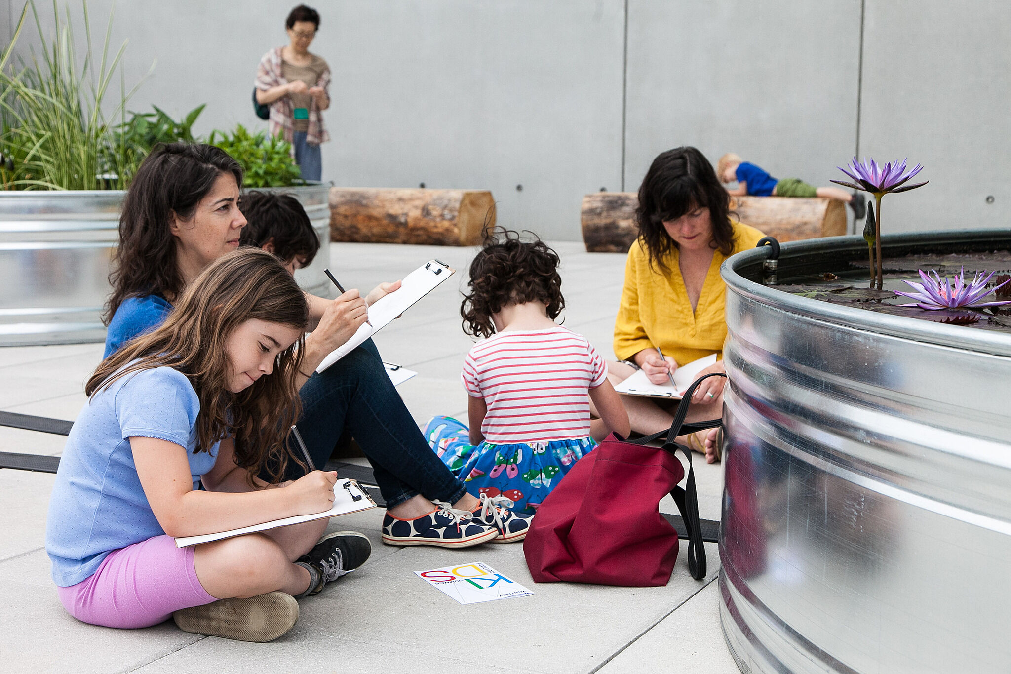 Families exploring art together on the terraces