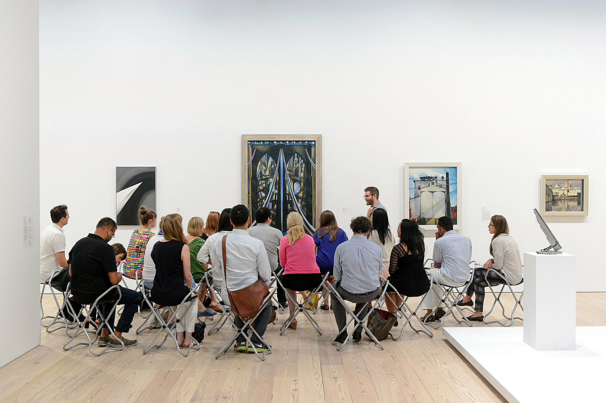 Educator Mark Joshua Epstein leads a tour in the galleries