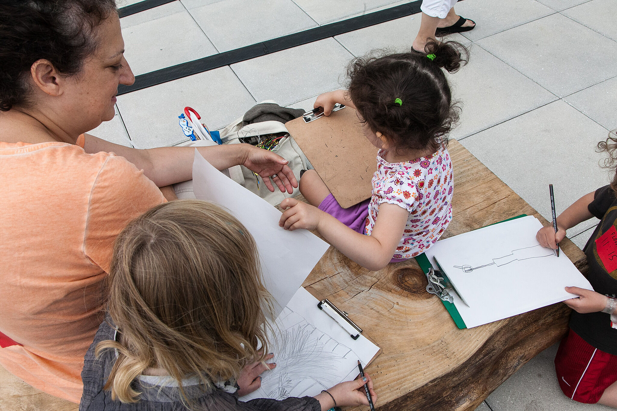 Families sketch together in the galleries