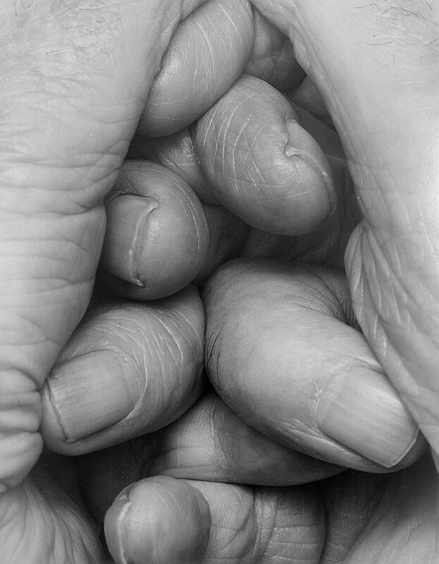 A black and white photograph by John Coplans. Fingers clasped.