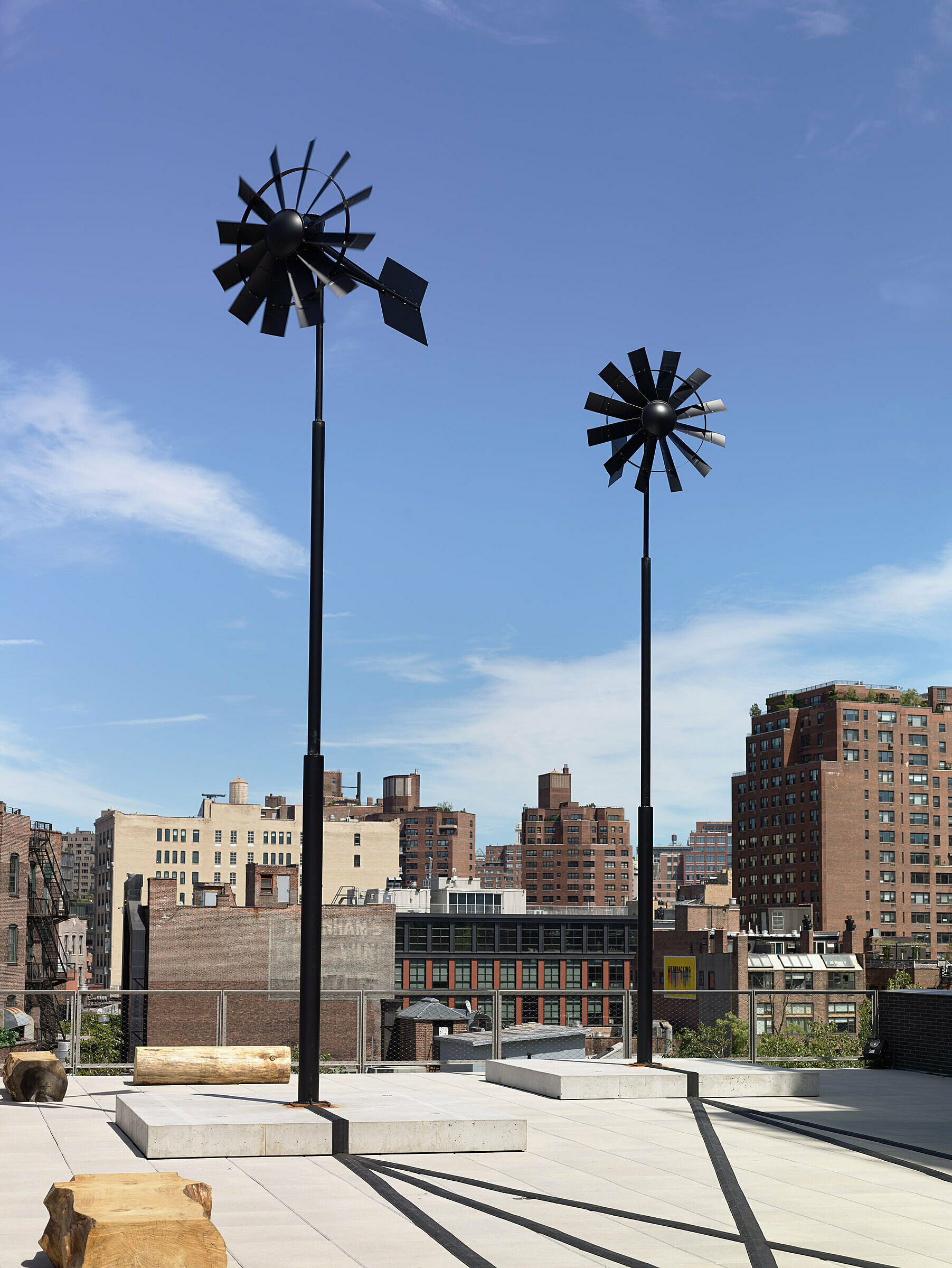 Virginia Overton's windmills artwork installed in a tree on the Randall's Island waterfront.