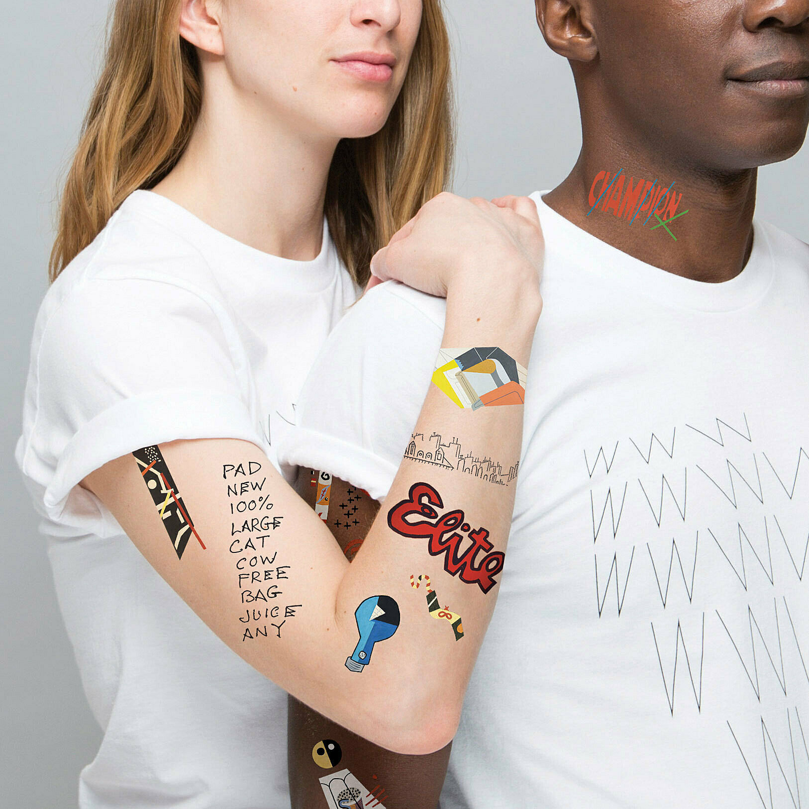 A model displays the custom tattoo set up Tattly on her arm.