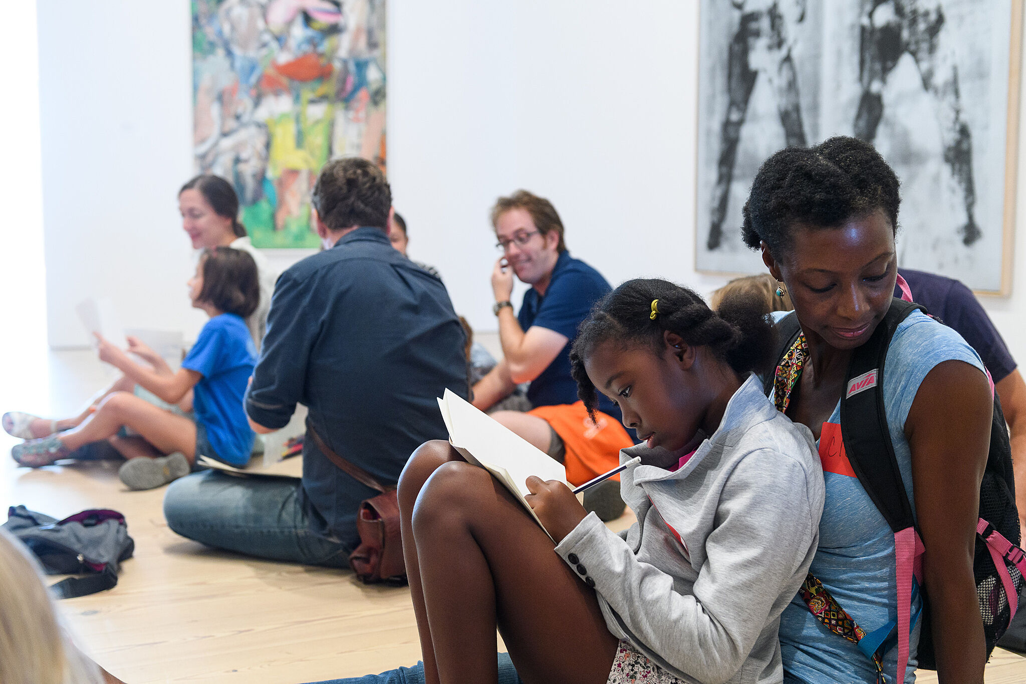 Families sketch together in the galleries